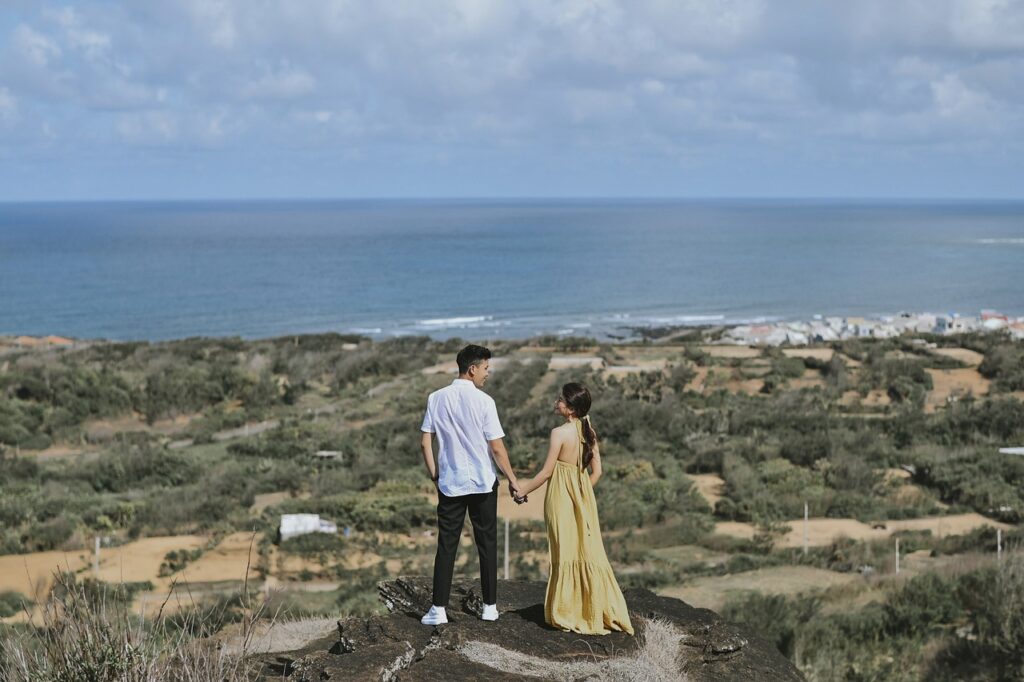 Love Journey Travel Quotes - couple at a lookout towards the ocean