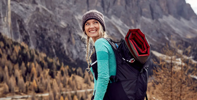 Blonde girl backpacking after reading 30 Journey Female Solo Travel Quotes