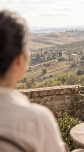 Elena in the Tuscan countryside with her book with Solo Travel Quotes